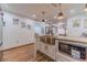 Well-lit kitchen with stainless steel microwave, granite countertop, and white cabinets, perfect for cooking at 4100 Springlake Cir, Buford, GA 30519