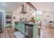 Bright kitchen featuring large island, stainless appliances, and breakfast bar seating at 4100 Springlake Cir, Buford, GA 30519