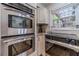 Modern kitchen featuring stainless steel appliances, a gas range, and a view of the outdoor pergola at 4100 Springlake Cir, Buford, GA 30519