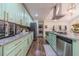 Modern kitchen with stainless steel appliances, custom cabinets, and granite countertops at 4100 Springlake Cir, Buford, GA 30519