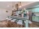 Open-concept kitchen with large island, stainless steel appliances, and barstool seating at 4100 Springlake Cir, Buford, GA 30519
