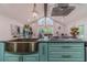 Gourmet kitchen with granite island, professional-grade appliances, and pendant lighting at 4100 Springlake Cir, Buford, GA 30519