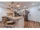 Well-equipped kitchen with granite countertops, stainless steel appliances, and breakfast bar seating at 4100 Springlake Cir, Buford, GA 30519