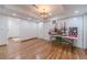 Large basement living area with laminate floors and recessed lighting and multiple walk in closets at 4100 Springlake Cir, Buford, GA 30519