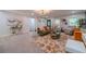 Inviting living room with hardwood floors, stylish rug, and comfortable seating arrangement at 4100 Springlake Cir, Buford, GA 30519