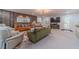A modern living room with stylish furniture, wood accent wall, and contemporary light fixture at 4100 Springlake Cir, Buford, GA 30519