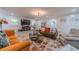 Cozy living room with plush seating, fireplace, and large windows for natural light at 4100 Springlake Cir, Buford, GA 30519
