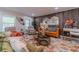 A modern living room with stylish furniture, wood accent wall, and unique area rug at 4100 Springlake Cir, Buford, GA 30519