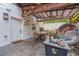 Outdoor patio with pergola, comfortable seating, and beautiful landscaping, perfect for outdoor dining at 4100 Springlake Cir, Buford, GA 30519