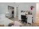 Light-filled bedroom features a spacious closet, desk, and lovely decor, perfect for relaxation or study at 6892 Autumn Hills Dr, Douglasville, GA 30135