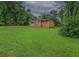 Traditional home with a brick and gray siding exterior, set on a spacious and green lot at 6892 Autumn Hills Dr, Douglasville, GA 30135