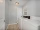Functional laundry room with tile flooring, washer, and dryer, offering convenience and practicality at 6892 Autumn Hills Dr, Douglasville, GA 30135