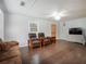 Spacious living room featuring hardwood floors, ceiling fan, and comfortable seating, perfect for relaxation at 6892 Autumn Hills Dr, Douglasville, GA 30135