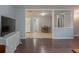 Open concept living area with hardwood floors transitioning into a tile kitchen, and a dining area at 6892 Autumn Hills Dr, Douglasville, GA 30135