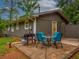 Back patio featuring outdoor dining set and BBQ grill at 6892 Autumn Hills Dr, Douglasville, GA 30135