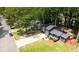 Aerial view showcases the property with lush trees, green lawns and surrounding neighborhood and a wooden deck at 805 Wayside Dr, Lawrenceville, GA 30046