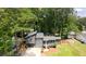 Aerial view showcases the property with lush trees, green lawns and surrounding neighborhood at 805 Wayside Dr, Lawrenceville, GA 30046
