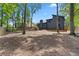 Expansive backyard featuring a wooden deck and a mix of trees and greenery in a private setting at 805 Wayside Dr, Lawrenceville, GA 30046