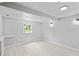 Finished basement with window view and light plank flooring at 805 Wayside Dr, Lawrenceville, GA 30046
