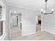 Bright dining room with laminate floors leading to living room and kitchen at 805 Wayside Dr, Lawrenceville, GA 30046