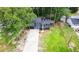 Charming renovated two-story home with new driveway, orange doors, and large yard at 805 Wayside Dr, Lawrenceville, GA 30046