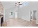 Bright living room with high ceilings, laminate floors, and a stone fireplace at 805 Wayside Dr, Lawrenceville, GA 30046