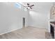 Bright living room with high ceilings, laminate floors, and a stone fireplace at 805 Wayside Dr, Lawrenceville, GA 30046