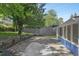 Spacious backyard featuring a concrete patio and a wooden fence at 1030 Brockdell Ct, Norcross, GA 30093