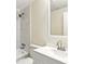 Bathroom featuring a white vanity with a stainless steel faucet, toilet, and shower with white marble tiling at 1030 Brockdell Ct, Norcross, GA 30093