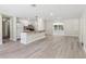 Open concept kitchen with white cabinets, granite countertops, and stainless steel appliances at 1030 Brockdell Ct, Norcross, GA 30093