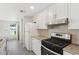 Well-equipped kitchen with white cabinets and granite countertops at 1030 Brockdell Ct, Norcross, GA 30093