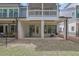 A private back patio with painted brick columns and a fenced in yard at 1110 Harper Dr, Roswell, GA 30076