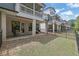 A view of the back of townhouses with fenced yards and patios on each level at 1110 Harper Dr, Roswell, GA 30076