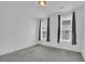 Cozy bedroom with carpet floors and natural light at 1110 Harper Dr, Roswell, GA 30076