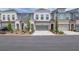 Charming townhome featuring a two-car garage and a beautifully landscaped front yard at 1110 Harper Dr, Roswell, GA 30076