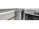 Modern laundry room with granite countertops and stainless steel washer and dryer at 1110 Harper Dr, Roswell, GA 30076