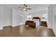 Large main bedroom with hardwood floors, ceiling fan, and ensuite bathroom at 1110 Harper Dr, Roswell, GA 30076