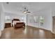 Spacious main bedroom featuring hardwood floors and abundant natural light at 1110 Harper Dr, Roswell, GA 30076