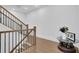 Elegant staircase with wood and black iron railings and hardwood floors at 1110 Harper Dr, Roswell, GA 30076