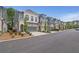 Street view of newly constructed townhomes with manicured landscaping at 1110 Harper Dr, Roswell, GA 30076