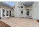 A tiled patio with a well-manicured lawn and white house is ideal for entertaining at 1250 Parkview Nw Ln, Kennesaw, GA 30152