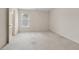 Bedroom featuring carpet, a window with blinds, and a doorway leading to a bathroom at 1250 Parkview Nw Ln, Kennesaw, GA 30152