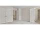 Bedroom with carpet, double closets, and a door leading to a hallway and an en-suite bathroom at 1250 Parkview Nw Ln, Kennesaw, GA 30152