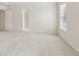 Large bedroom with a bright window and an open doorway leading to another room at 1250 Parkview Nw Ln, Kennesaw, GA 30152
