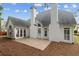 Exterior shot of home featuring white siding, patio, and a landscaped yard at 1250 Parkview Nw Ln, Kennesaw, GA 30152