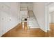 Bright foyer with hardwood floors, a staircase, and access to multiple rooms at 1250 Parkview Nw Ln, Kennesaw, GA 30152