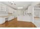 Spacious, bright kitchen with white cabinets, breakfast bar and hardwood floors at 1250 Parkview Nw Ln, Kennesaw, GA 30152