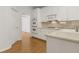 Corner view of the kitchen featuring double ovens and hardwood floors at 1250 Parkview Nw Ln, Kennesaw, GA 30152