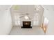 Bright living room with high ceilings, fireplace, and large windows with plantation shutters at 1250 Parkview Nw Ln, Kennesaw, GA 30152