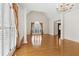Bright living room featuring hardwood floors, columns and large windows at 1250 Parkview Nw Ln, Kennesaw, GA 30152